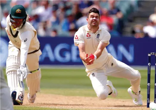  ?? Reuters ?? James Anderson strives to take a catch off his bowling on Day 4 of the second Test. Anderson’s five wickets helped England get back into the game against Australia