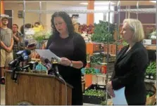  ??  ?? Capital Roots Executive Director Amy Klein speaks about the importance of offering fresh foods to families as U.S. Senator Kirsten Gillibrand looks on.