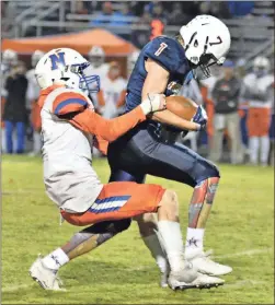  ?? / Michelle Petteys, Heritage Snapshots ?? Heritage receiver Nolan Letzgus tries to fight though a tackle during Friday’s 5628 win over Northwest Whitfield. Letzgus caught nine passes for 226 yards and added an 87-yard kick return. He also had an 85-yard punt return called back on a penalty.