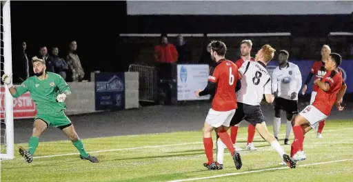  ?? PETER HARMAN ?? Josh Yorwerth scores the second goal for Merthyr Town against Kettering