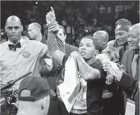  ?? KEVIN RICHARDSON/BALTIMORE SUN ?? Referee Harvey Dock raises the hand of WBA super featherwei­ght champion Gervonta Davis after he scored a first-round TKO of challenger Ricardo Núñez at Royal Farms Arena in 2019.