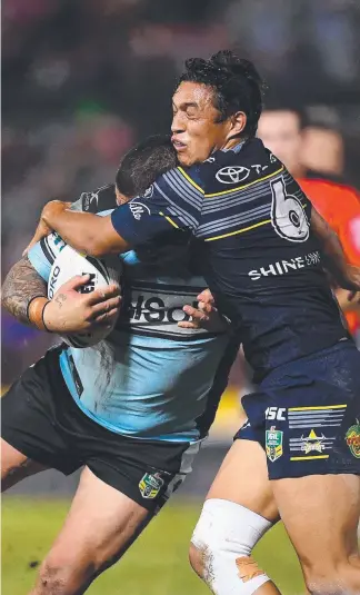  ?? Picture: GETTY IMAGES ?? Te Maire Martin brings down Sharks prop Andrew Fifita in Townsville.