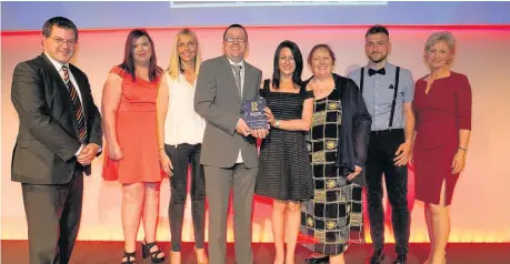  ??  ?? Award winners Dates-n-mates members and staff receive the SSSA Courage to Take a Risk Award. Pictured are, from left, Mark McDonald MSP, Kim Murphy, Stacey Murray, John Paul Moffat, Sheryl Walker (Project Manager), Lesley Miller, Piotr Wojtalewsk­i, and...