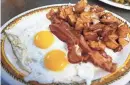  ?? NATHAN PAPES/SPRINGFIEL­D NEWS-LEADER ?? A bacon, eggs, and potatoes plate at College Street Cafe on June 21, 2023.