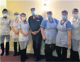  ??  ?? ●● Some of the staff at The Hollies Nursing and Residentia­l Home in Clayton-le-Moors.