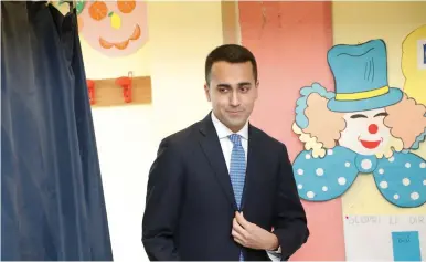  ?? (Ciro De Luca/Reuters) ?? 5-STAR MOVEMENT LEADER Luigi Di Maio casts his vote in Pomigliano d’Arco in March.