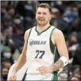  ?? TIM HEITMAN — THE ASSOCIATED PRESS ?? Dallas’ Luka Doncic had 22points, 14rebounds and 14assists in the Mavericks’ win over Chicago on Sunday.