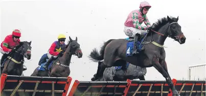  ?? Picture: Getty. ?? Martha Mccandles, ridden by Wayne Hutchinson, on the way to victory at Exeter.