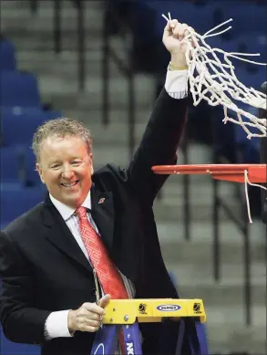  ?? Sue Ogrocki / Associated Press ?? Houston head coach Tom Penders waves the net after Houston defeated UTEP 81-73 in the CUSA men’s championsh­ip NCAA college basketball game in Tulsa, Okla., in 2010. Penders was recently rewarded for his career with a nomination to the College Basketball Hall of Fame.