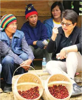  ??  ?? PCBI president Chit Juan talks with coffee farmers from Benguet during a recent visit; Juan came with Ted Lingle, global coffee guru, and US CQI operations director Lisa Conway.