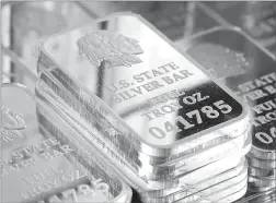  ??  ?? A sneAk peAk inside silver vAult bricks: Pictured left reveals the valuable .999 pure fine silver bars inside each State Silver Vault Brick. Pictured right are the State Silver Vault Bricks containing the only U.S. State Silver Bars known to exist with...