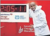  ?? AFP ?? Mo Farah celebrates his Chicago Marathon win on Sunday.