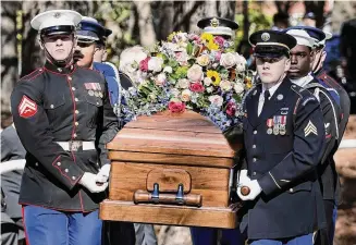  ?? Erik S. Lesser/Associated Press ?? An Armed Forces body bearer team carries the casket of former first lady Rosalynn Carter from the Jimmy Carter Presidenti­al Library and Museum, Tuesday, in Atlanta.