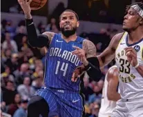  ?? DOUG MCSCHOOLER/AP ?? Magic guard D.J. Augustin had 3 points, 4 assists and 2 rebounds Saturday night in Indiana before an ankle injury sidelined him.