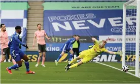  ?? Photograph: Alex Pantling/AFP/Getty Images ?? Leicester’s Kelechi Iheanacho sees his shot beat Aaron Ramsdale to open the scoring against Sheffield United.