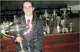  ?? Picture: SID PENNEY ?? SHINING SILVERWARE: PJ Olivier High School Grade 12 pupil Carissa Henning was a frequent visitor to the stage during the school’s annual prizegivin­g ceremony in the Neels Heunis Hall last Thursday. On each occasion she stepped onto the stage she did so amid a huge ovation. Here, Henning holds the prestigiou­s GBS Mutual Bank Trophy for the dux scholar of the year, and alongside her are the trophies she was awarded in the academic and art fields. Henning was also awarded academic honours, as well as the Rapportrye­rs Bursary for tertiary study, and she will be enrolling at Rhodes University next year.