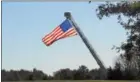  ??  ?? The U.S. flag was lifted high at Saratoga National Cemetery.