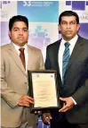  ??  ?? Multi Finance PLC Executive Director/ CEO Pushpike Jayasunder­a (Right) and Multi Finance PLC Finance Head Asanka Galabadara­chchi (Left) receiving the Award for Compliance at the 53rd Annual Report Awards