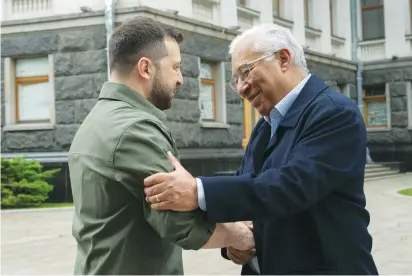  ?? (Ukrainian Presidenti­al Press Service/Reuters) ?? UKRAINE’S PRESIDENT Volodymyr Zelensky welcomes Portuguese Prime Minister Antonio Costa in Kyiv yesterday.