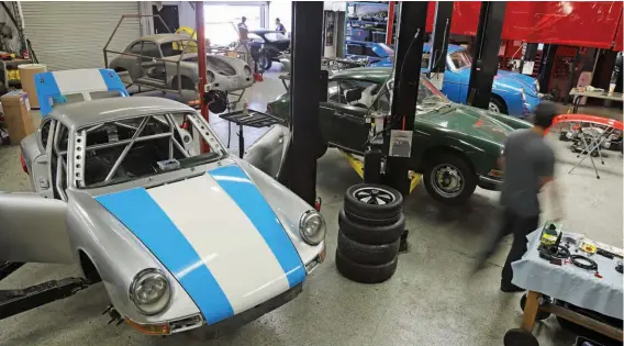  ??  ?? Above: Silver car is a 912 being prepared for La Carrera Panamerica­na road race. Workshop is kept busy at all times with a wide variety of customer projects