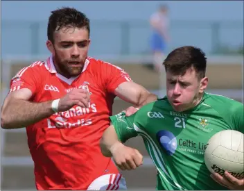  ??  ?? Tom Byrne of Kilmore tries to negotiate a route past Christy Lane (St. Mary’s, Maudlintow­n).