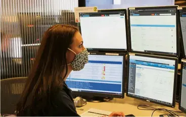  ?? — Reuters ?? A critical care nurse monitors patients in intensive care units (ICUs) across the United States remotely from a centralise­d operations centre in St Louis, Missouri.