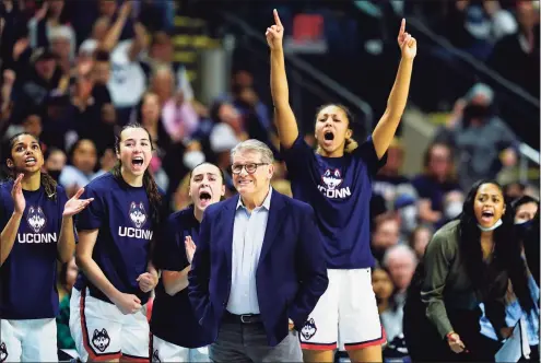  ?? Frank Franklin II / Associated Press ?? UConn players and coach Geno Auriemma react during the first quarter against Indiana in the Sweet Sixteen round of the NCAA Tournament Saturday in Bridgeport.