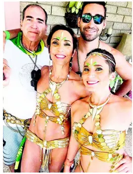  ?? CONTRIBUTE­D PHOTOS ?? Bianca Hernould (front) takes a quick photo with her father Malcolm (left), mother Rachel and brother Johnathan before heading out for road march.