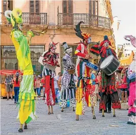  ?? ?? Stiltwalke­rs, Carnival of Santiago de Cuba.