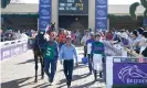  ??  ?? Runners and riders head to the paddock at Santa Anita. Photograph: Pat Healy/ racingfoto­s.com/Rex/Shuttersto­ck