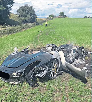  ??  ?? More than pride was dented: the Ferrari 430 Scuderia after the driver crashed it in a field off the M1 near Barnsley, South Yorkshire