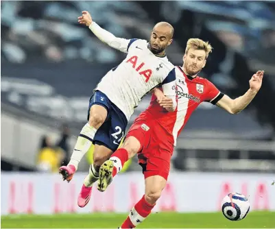  ?? PHOTOGETTY IMAGES ?? Lean on me . . . Tottenham Hotspur forward Lucas Moura (left) battles for possession with Southampto­n midfielder Stuart Armstrong during the English Premier League match in London yesterday. Spurs won 21.