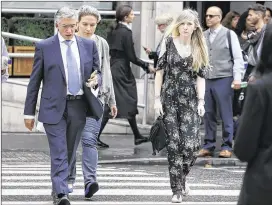  ?? KIRSTY WIGGLESWOR­TH / ASSOCIATED PRESS ?? Connie Yates (right), mother of critically ill baby Charlie Gard, arrives with her legal team at the Royal Courts of Justice in London on Wednesday. A British judge ruled that the baby will be taken to hospice.