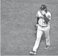  ?? PAUL RUTHERFORD/USA TODAY SPORTS ?? Astros starting pitcher Gerrit Cole walks off of the field after allowing three runs in the third inning against the Red Sox in Game 2 of the ALCS on Sunday in Boston.