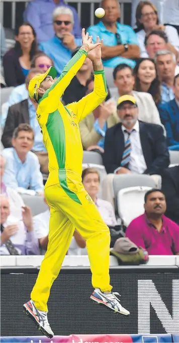  ?? Picture: ADRIAN DENNIS/AFP ?? Glenn Maxwell saved a six in brilliant fashion before flicking it back in play for Australian captain Aaron Finch to complete the dismissal of Chris Woakes against England in a World Cup pool game