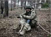  ?? ROMAN CHOP — THE ASSOCIATED PRESS ?? A Ukrainian serviceman take a rest on the frontline at an undisclose­d location in the Donetsk region, Ukraine.
