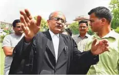  ?? PTI ?? Lawyer Prashant Bhushan, one of the petitioner­s, addresses journalist­s after the Supreme Court dismissed the please seeking a probe into Judge B.H. Loya’s death.