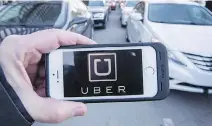  ?? RYAN REMIORZ/THE CANADIAN PRESS ?? Uber has signalled it wants to see all cars in major urban areas controlled by fleets, with no private cars.