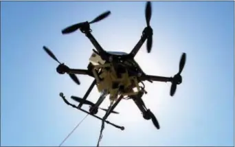  ?? NATI HARNIK — THE ASSOCIATED PRESS FILE ?? This file photo shows a drone at a testing site in Lincoln, Neb. An experiment­al study in Sweden suggests drones equipped with heart defibrilla­tors could help with response times for out-of-hospital cardiac arrest. Drones arrived at the scene of...