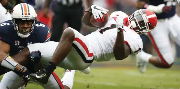  ?? BRYNN ANDERSON/THE ASSOCIATED PRESS FILE PHOTO ?? Georgia had two 1,000-yard rushers in the same season for the first time, including star Sony Michel. The Bulldogs face Alabama in the national championsh­ip game in Atlanta on Monday.
