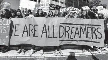  ?? FREDERIC J. BROWN Getty Images, file ?? Advocates march in support of DACA, which protects some young undocument­ed immigrants from deportatio­n.