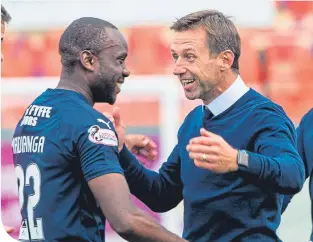  ??  ?? A delighted Neil McCann with late scorer Madianga at full-time