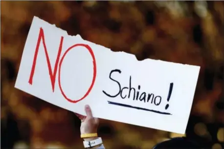  ?? CALVIN MATTHEIS — KNOXVILLE NEWS SENTINEL VIA AP ?? A Tennessee fan holds a sign reading “No Schiano!” during a gathering of Tennessee fans reacting to the possibilit­y of hiring Ohio State defensive coordinato­r Greg Schiano for its head coaching vacancy on Sunday in Knoxville, Tenn.