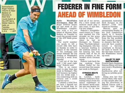  ?? — AFP ?? Switzerlan­d’s Roger Federer returns to Aljaz Bedene of Slovenia in their first round match at the ATP Gerry Weber Open in Halle on Tuesday. Federer won 63, 6-4.