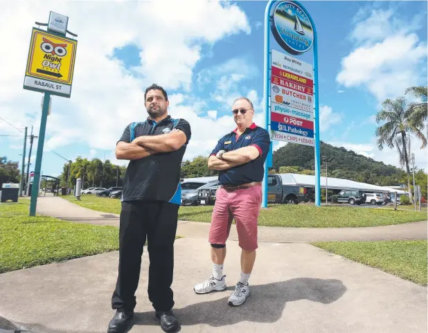  ?? Picture: STEWART McLEAN ?? APPREHENSI­VE: Trinity Beach Quality Meats’ Brett Harland and Bruce Sharples from Trinity Beach News agency are unhappy with Woolies’ proposal.