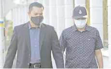  ??  ?? Mohd Shah (right) pleaded guilty to two counts of corruption, involving RM2,100. - Bernama photo