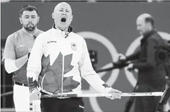  ?? AARON FAVILA THE ASSOCIATED PRESS ?? Canada skip Kevin Koe, who has his team in better position, reacts in a match against the U.S. on Monday.