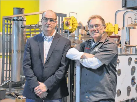  ?? MITSUKI MORI/THE GUARDIAN ?? David Campbell, left, and Peter Toombs of Advanced Extraction­s Systems Inc. in Charlottet­own recently received the emerging business award from the Greater Charlottet­own Area Chamber of Commerce.