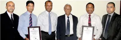  ??  ?? From left: Indexpo Certificat­ions Ltd General Manager Widya Karunaratn­e, Ceylon Tapes (Pvt.) Ltd Business Manager Shanaka Pelpola, Ceylon Tapes (Pvt.) Ltd Managing Director K.P. David, Indexpo Certificat­ions Ltd Director/ceo Shantha Kuruppumul­lage,...