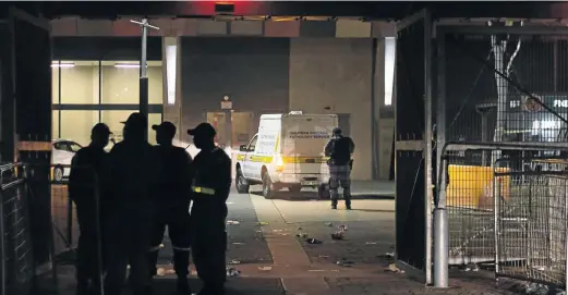  ?? /TADEU ANDRE/AFP ?? Emergency service and forensic pathology vehicle leaves the FNB Stadium, where two people were killed in a stampede during the annual Carling Black Label Cup fixture between Kaizer Chiefs and Orlando Pirates.